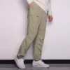 Pantalones informales de hombre Converse de color liso, tejido y corte recto, gris claro y verde